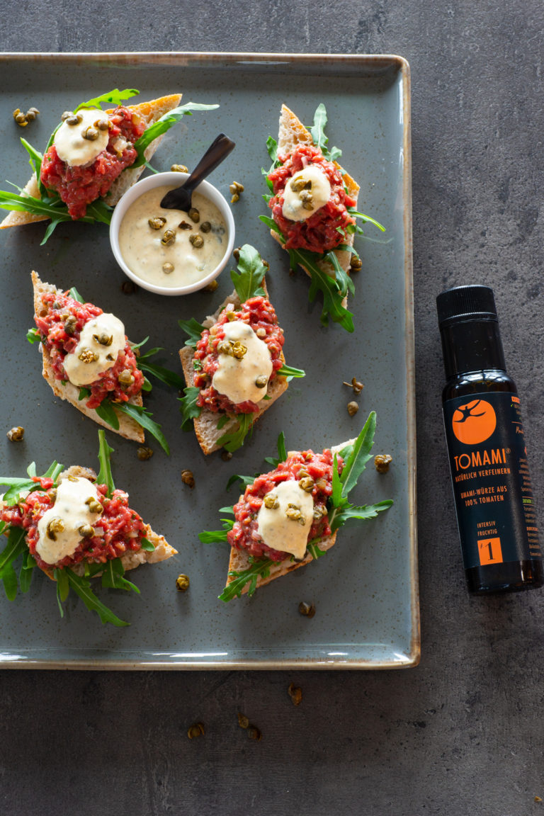 Teaser BEEF STEAK TARTARE with Tomami # 1, caper mayonnaise and rocket leaves