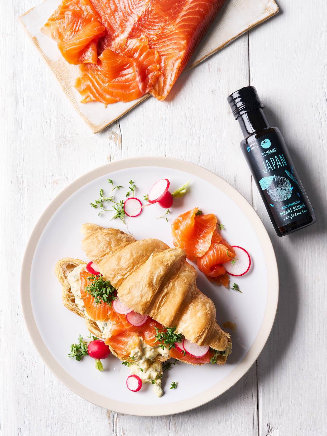 Marinated breakfast trout in a croissant with egg salad